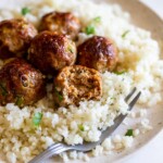 Turkey meatballs sitting on bed of rice