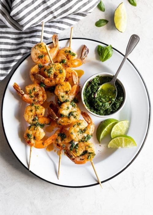 Flavorful, easy-to-make shrimp skewers made with a fresh, homemade basil chimichurri. A great appetizer or main dish ready in less than 15 minutes!