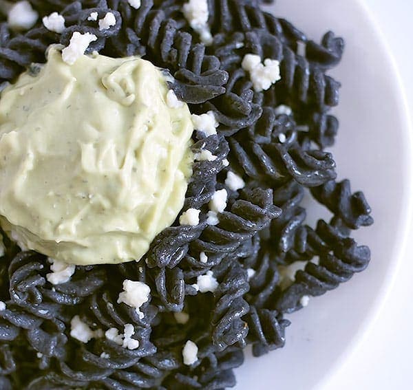 Black bean rotini served with avocado crema