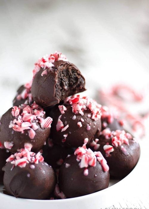 Crushed candy canes, crushed Oreo cookies, cream cheese, and melted dark chocolate result in the easiest, most refreshing, and festive dessert ever - Chocolate Peppermint Oreo Truffles!