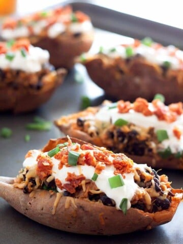 Crispy sweet potato skins loaded with gouda, chorizo, black beans, sour cream and scallions! Perfect for a weeknight meal, side dish, or game day!
