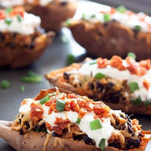 Crispy sweet potato skins loaded with gouda, chorizo, black beans, sour cream and scallions! Perfect for a weeknight meal, side dish, or game day!
