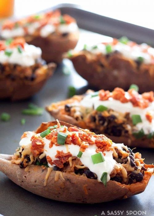 Crispy sweet potato skins loaded with gouda, chorizo, black beans, sour cream and scallions! Perfect for a weeknight meal, side dish, or game day!