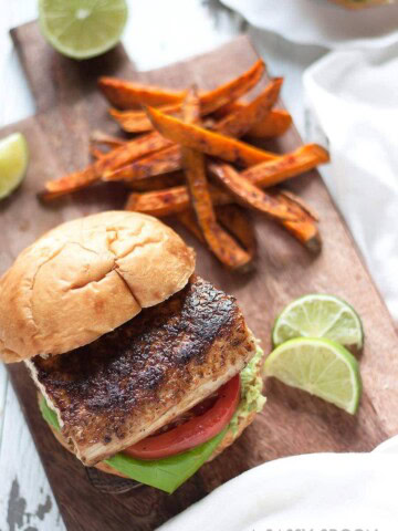 Blackened mahi-mahi sandwich served with sweet potato fries