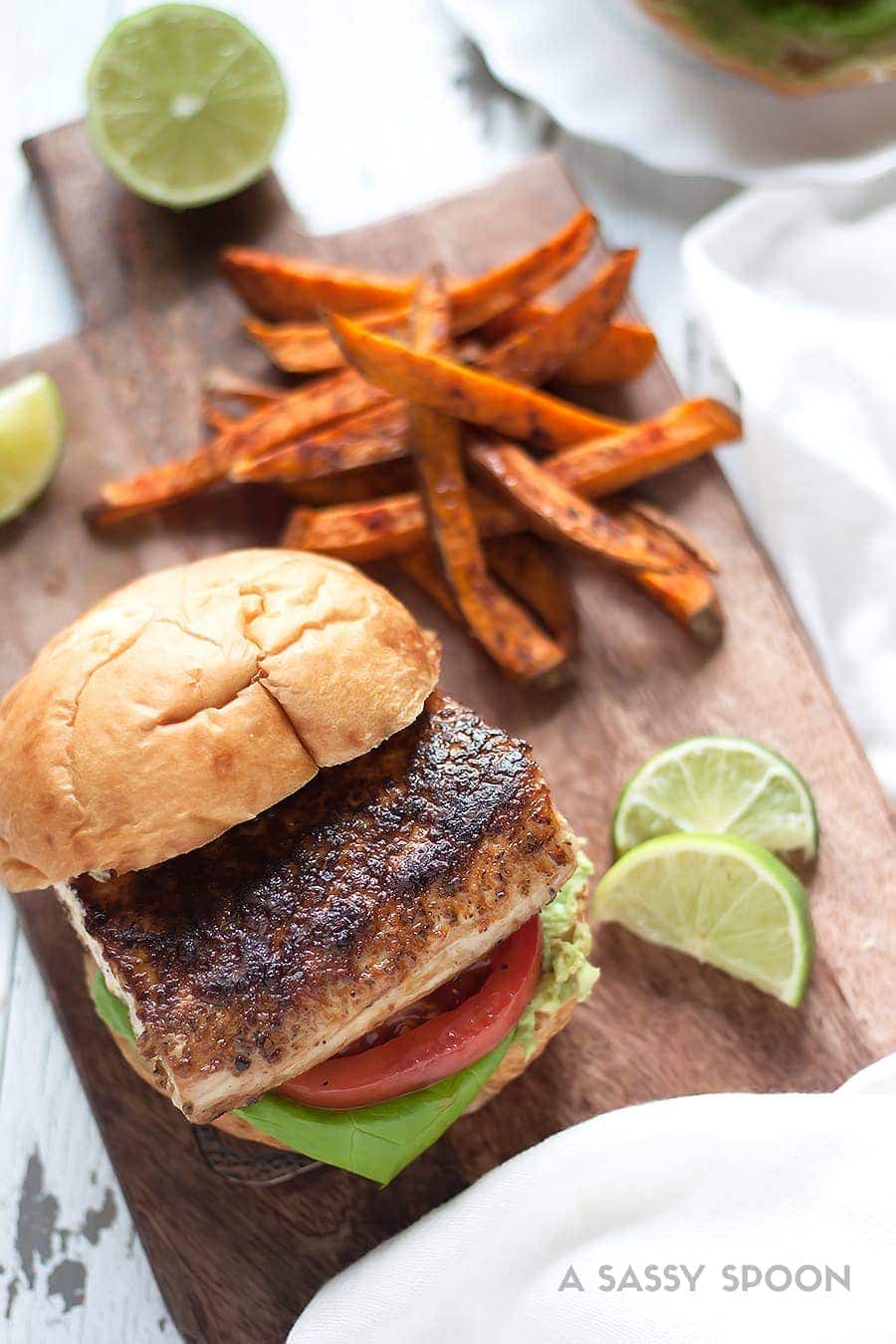 Blackened mahi-mahi sandwich served with sweet potato fries