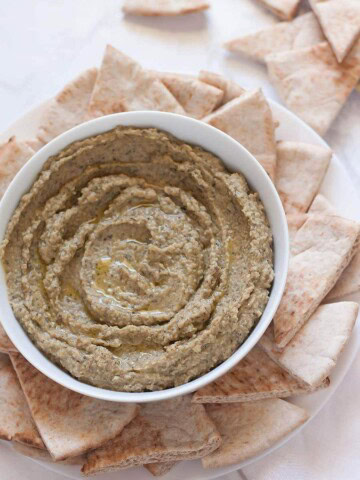 Kalamata olive hummus without tahini! A creamy, boldly flavored hummus made with kalamata olives, garlic, and spices. Perfect snack ready in 5 minutes!