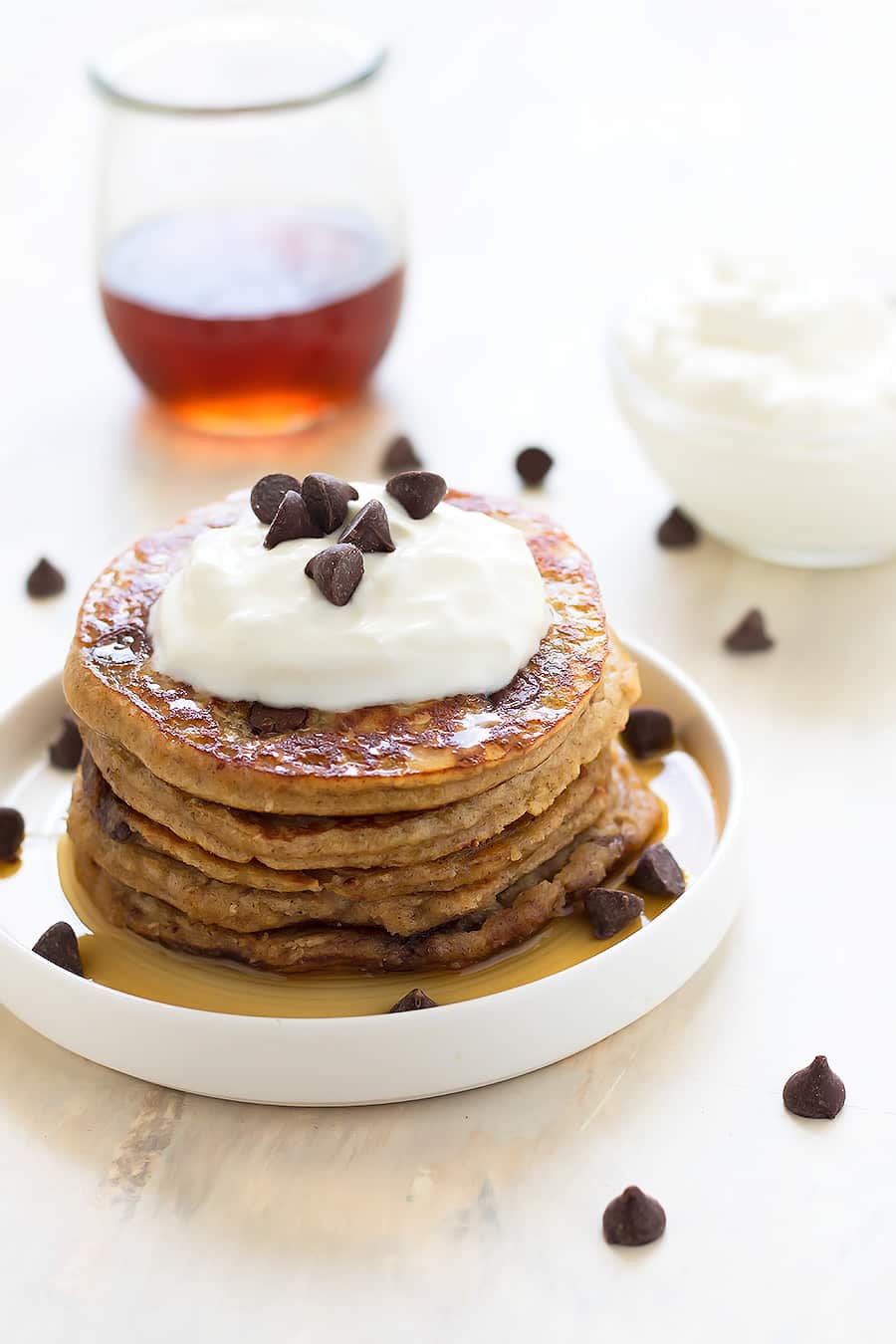 Fluffy, healthy, grain-free, dairy-free, refined sugar free, low carb chocolate chip pancakes made with almond flour, raw honey, and dark chocolate chips!