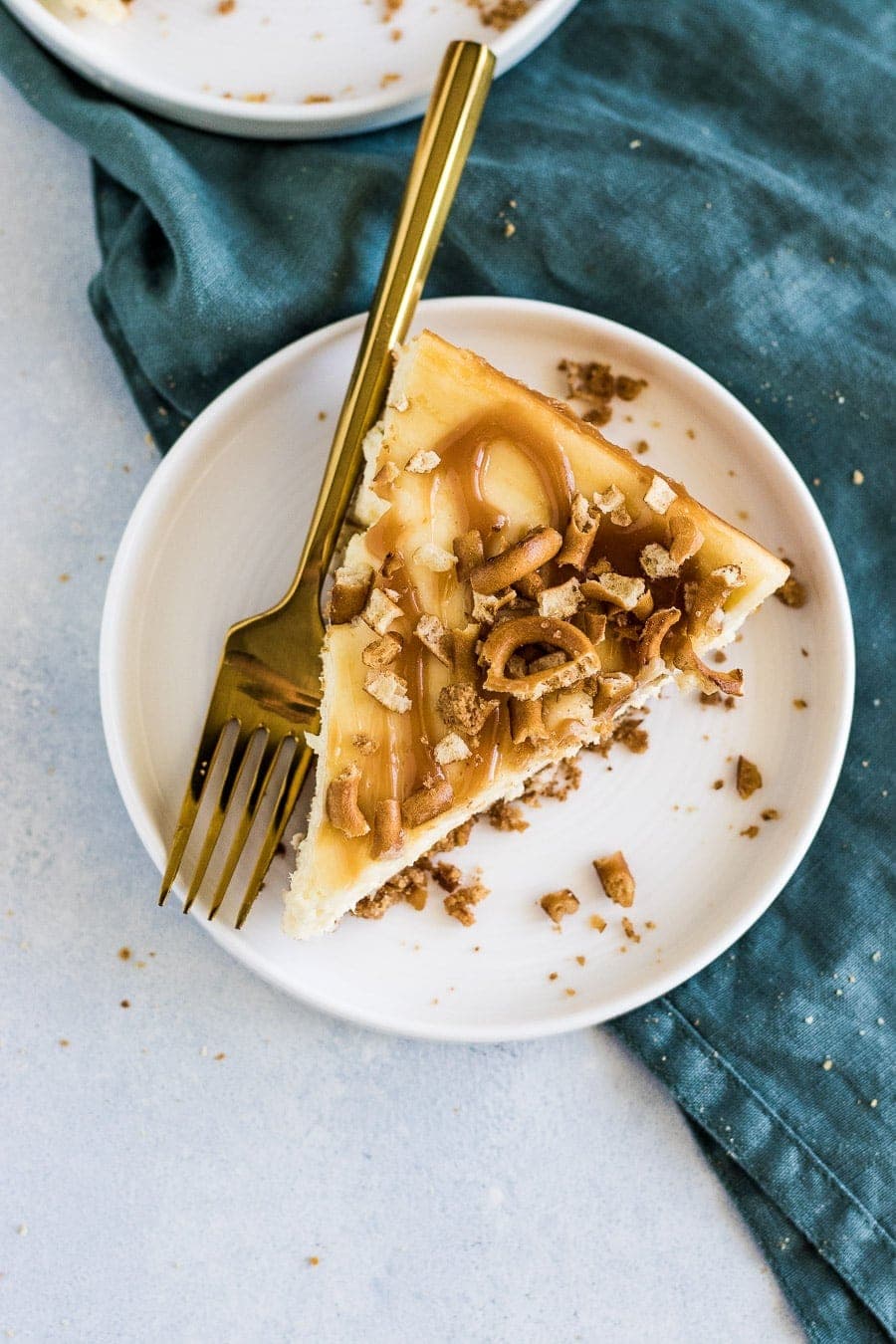 Deliciously creamy, small batch salted caramel pretzel cheesecake made with graham crackers, pretzels, and salted caramel.