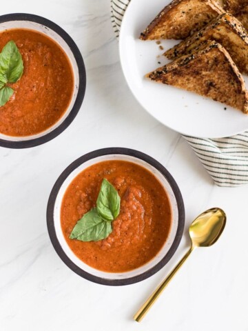 A deliciously simple homemade roasted tomato basil soup that you can enjoy all year round with a melty grilled cheese made with Irish whiskey butter!