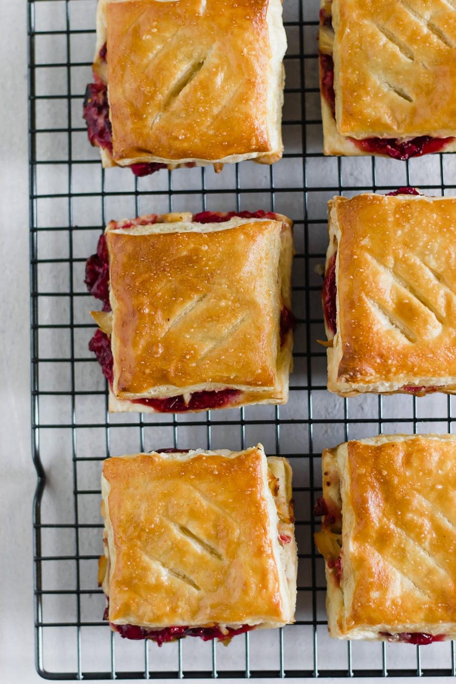 Leftover Cranberry + Turkey Pastries. Repurpose Thanksgiving leftovers by making savory sweet pastelitos (aka pastries or hand pies) using puff pastry sheets!