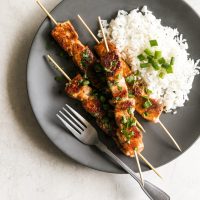 Salmon marinated in honey, garlic, soy sauce, fresh lime juice then cooked on skewers for 10 minutes in a cast iron skillet. A simple yet gourmet weeknight meal!