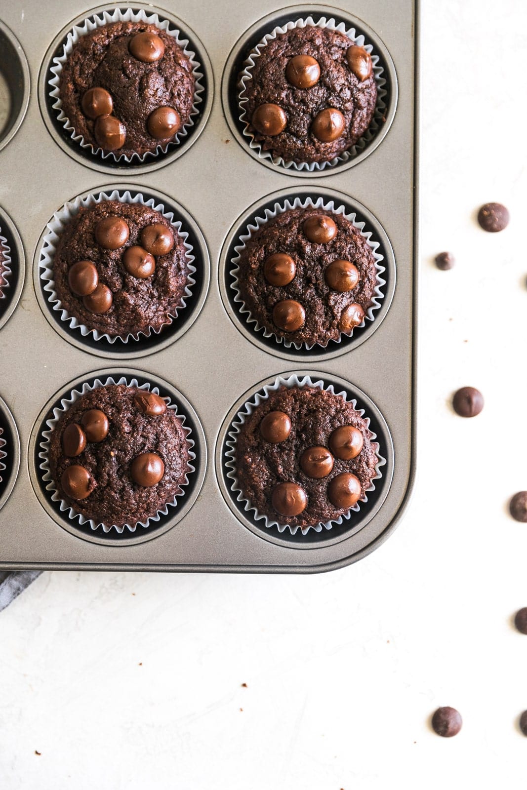 Soft, rich, guilt-free, refined sugar-free, homemade double chocolate banana muffins. Perfect for breakfast and ready in just 30 minutes!