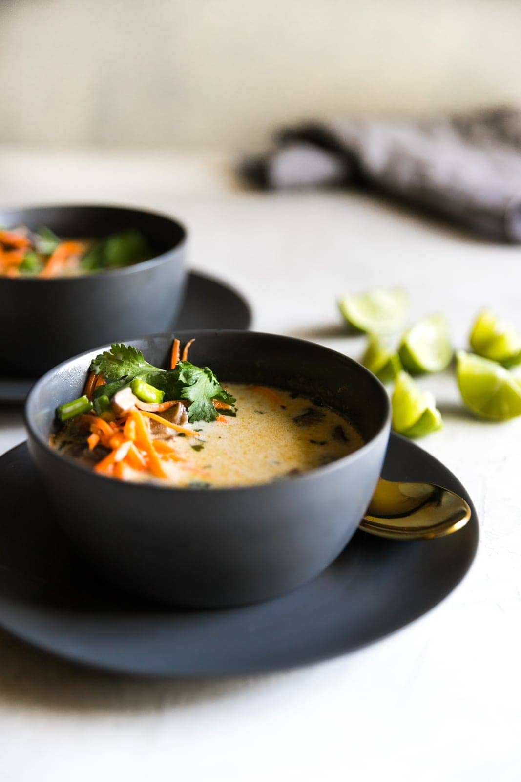 Two bowls of Thai coconut soup