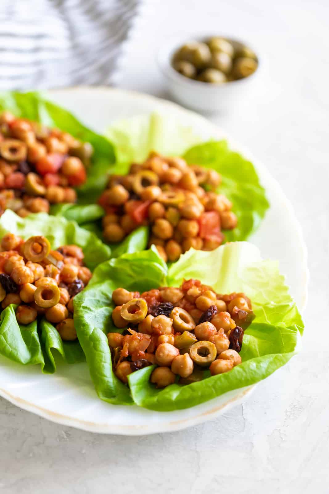 This chickpea vegan picadillo is a plant-based meal made Cuban-style with spices, onions, garlic, tomatoes, olives and raisins. A quick weeknight dinner!