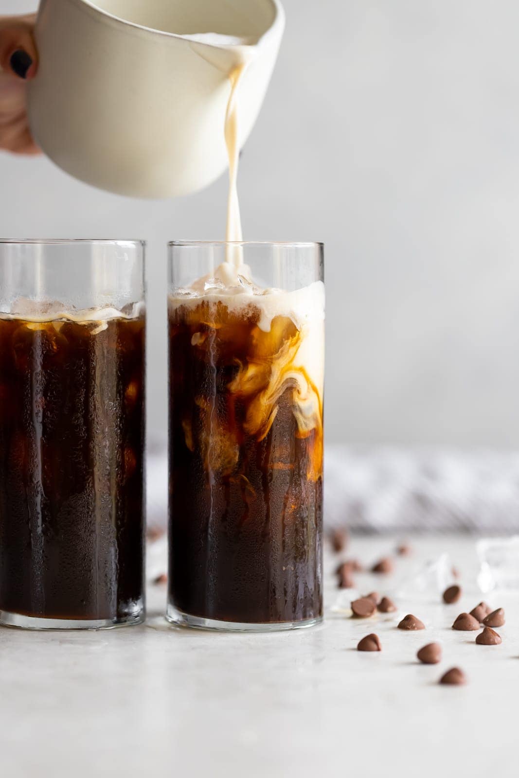 A frothy dairy-free cafe con leche (milk with coffee drink) made iced with sweetened Cuban coffee, creamer, and almond milk.