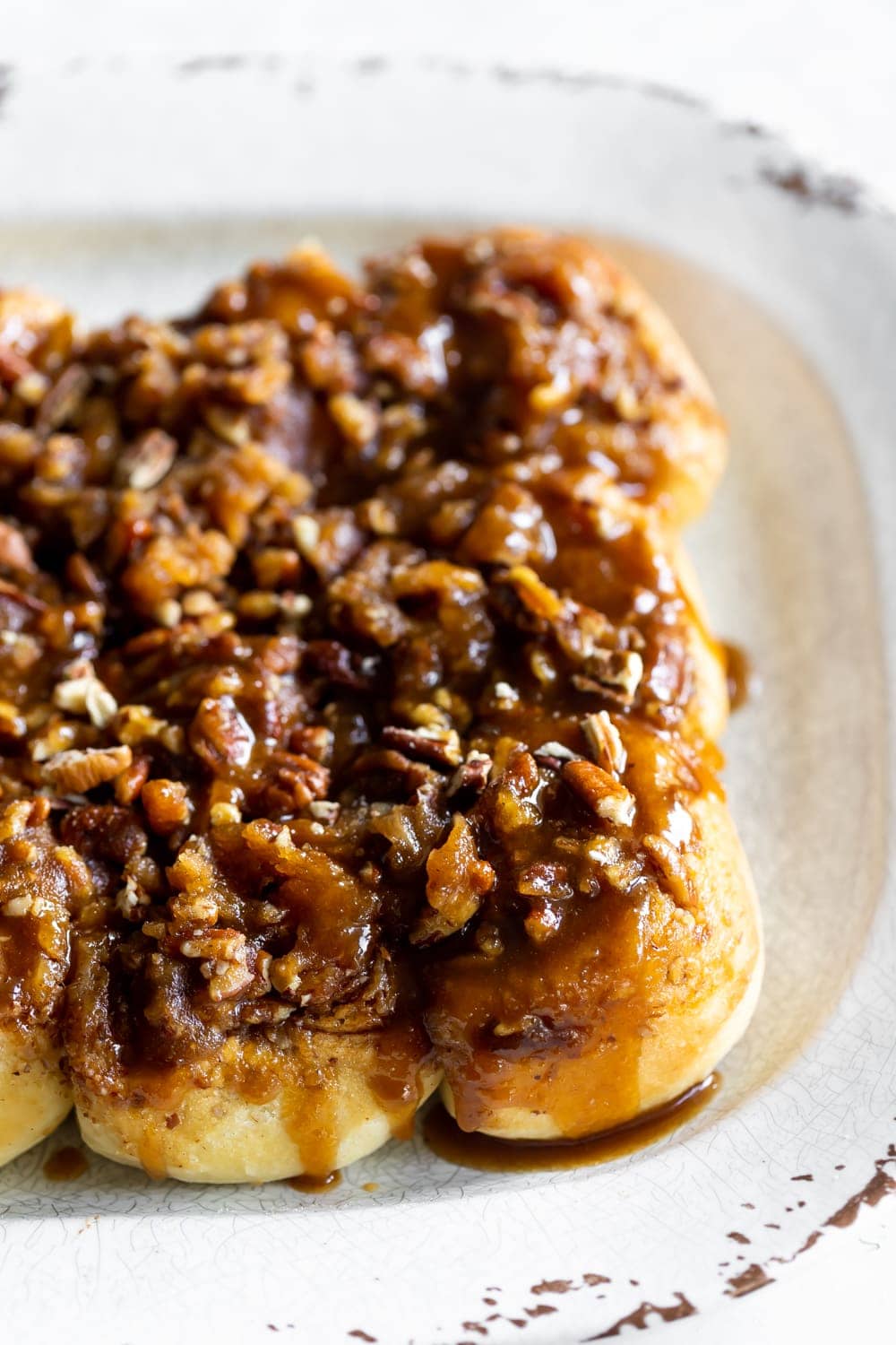 sticky buns made from scratch with chopped pecans and rum toffee sauce