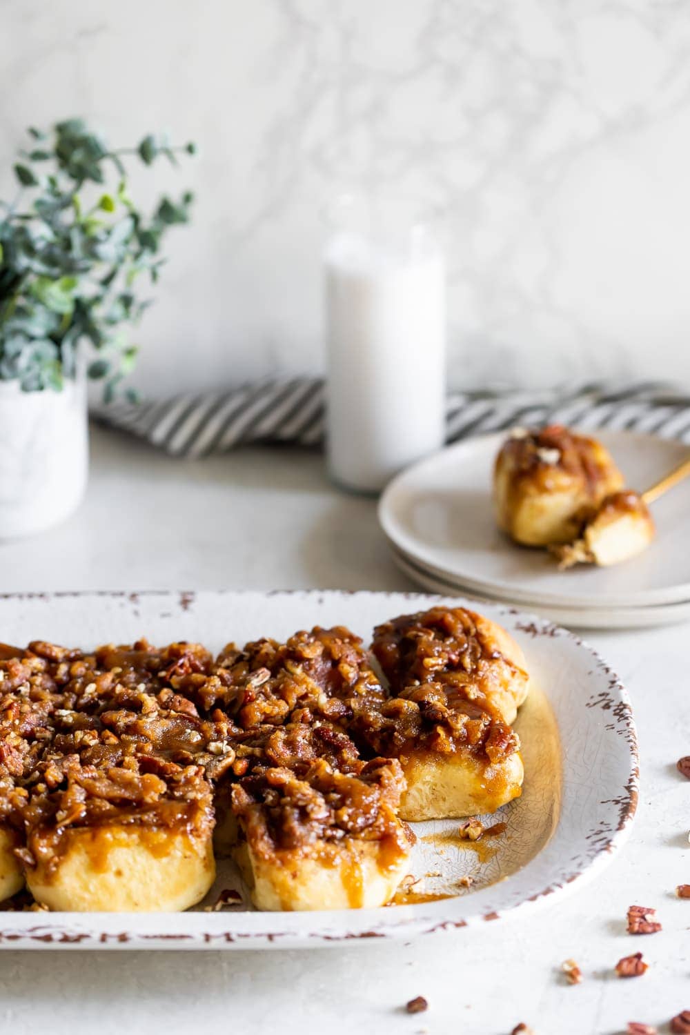 pecan stick buns with rum toffee sauce on a serving tray
