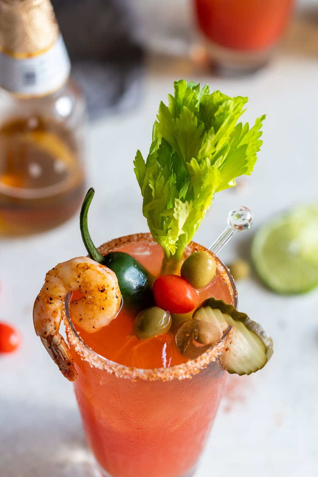 garnishes on a blood mary in a glass
