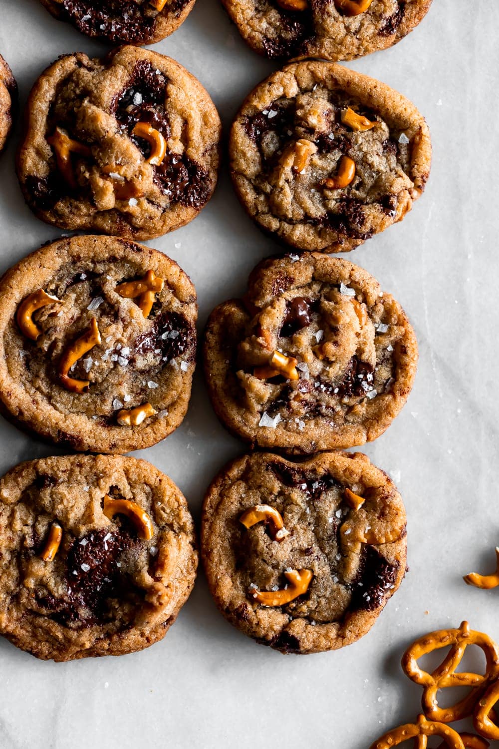 brown butter chocolate chip pretzel cookies on a marble slab 