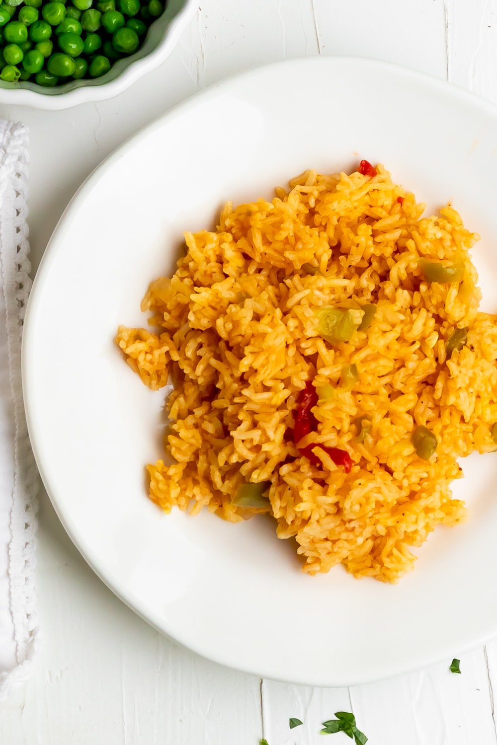 Cuban yellow rice on a white plate on a white table