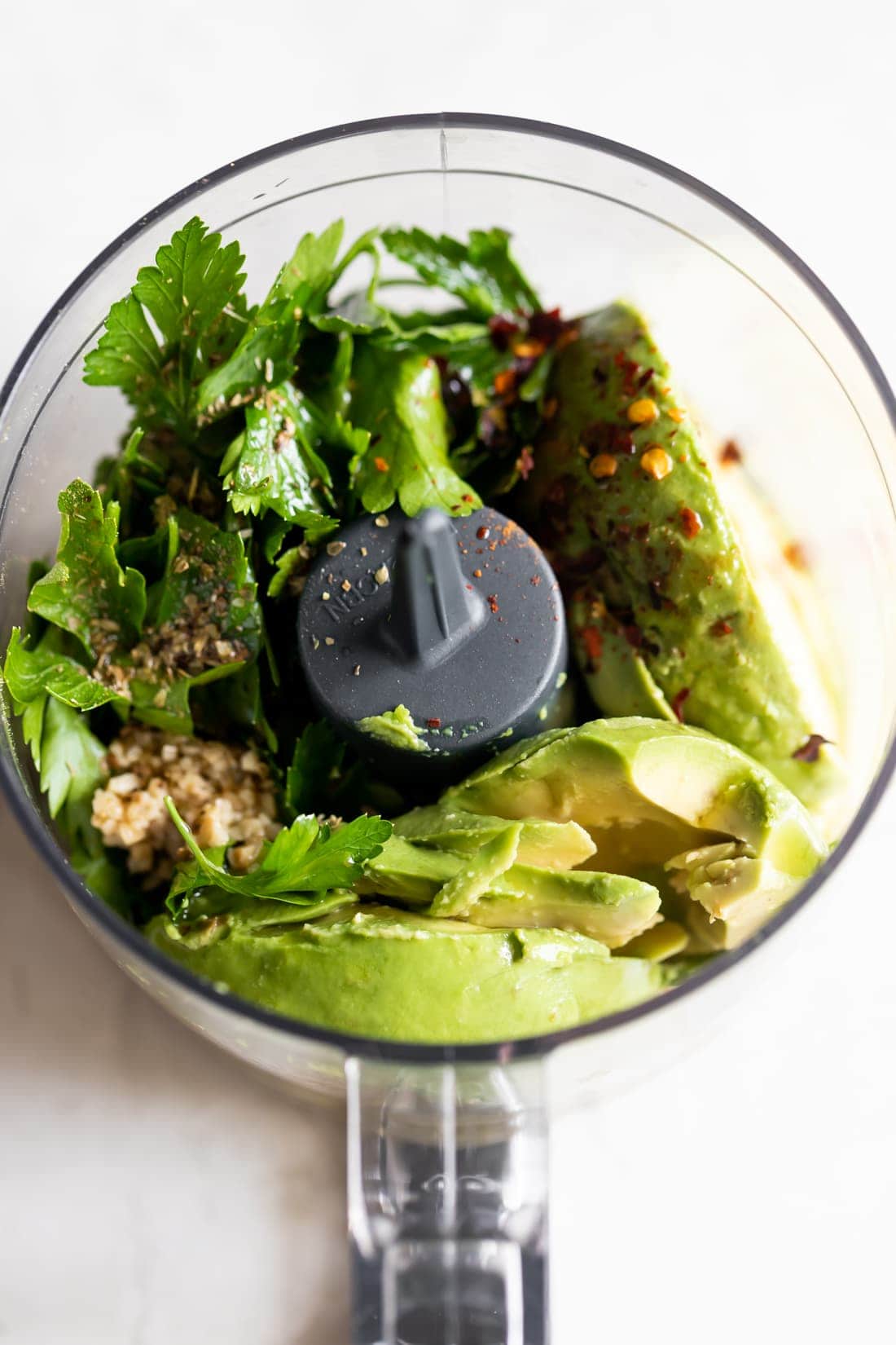 avocado chimichurri ingredients in the food processor