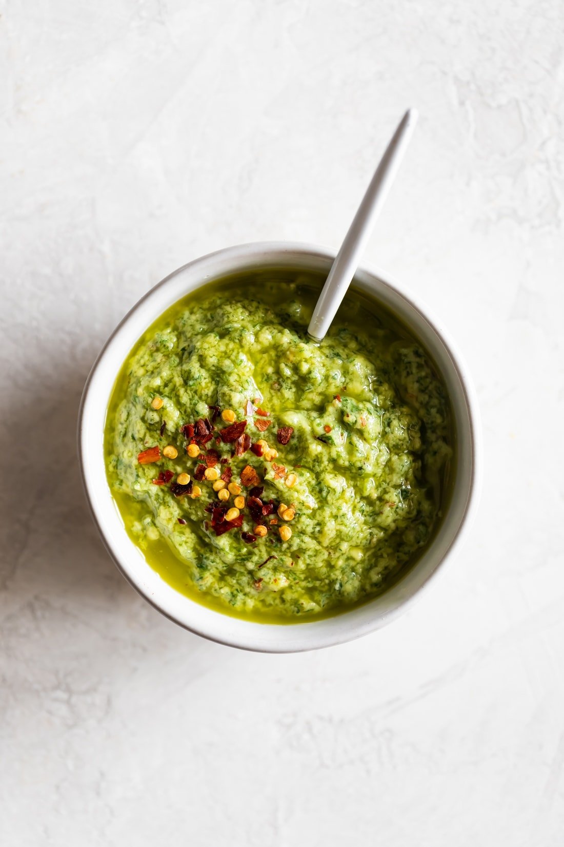 avocado chimichurri in a bowl with a spoon