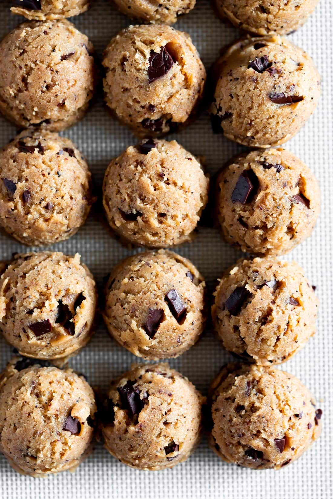 cookie dough balls on a baking sheet for brown butter chocolate chip cookies