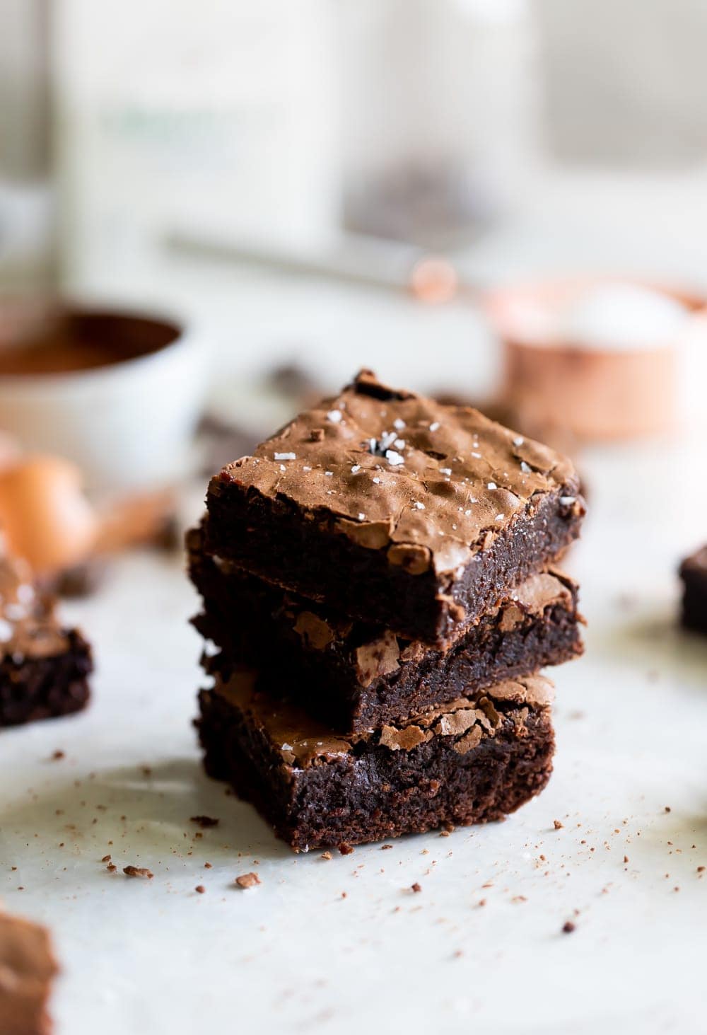 stack of chewy fudge brownies with flaky salt