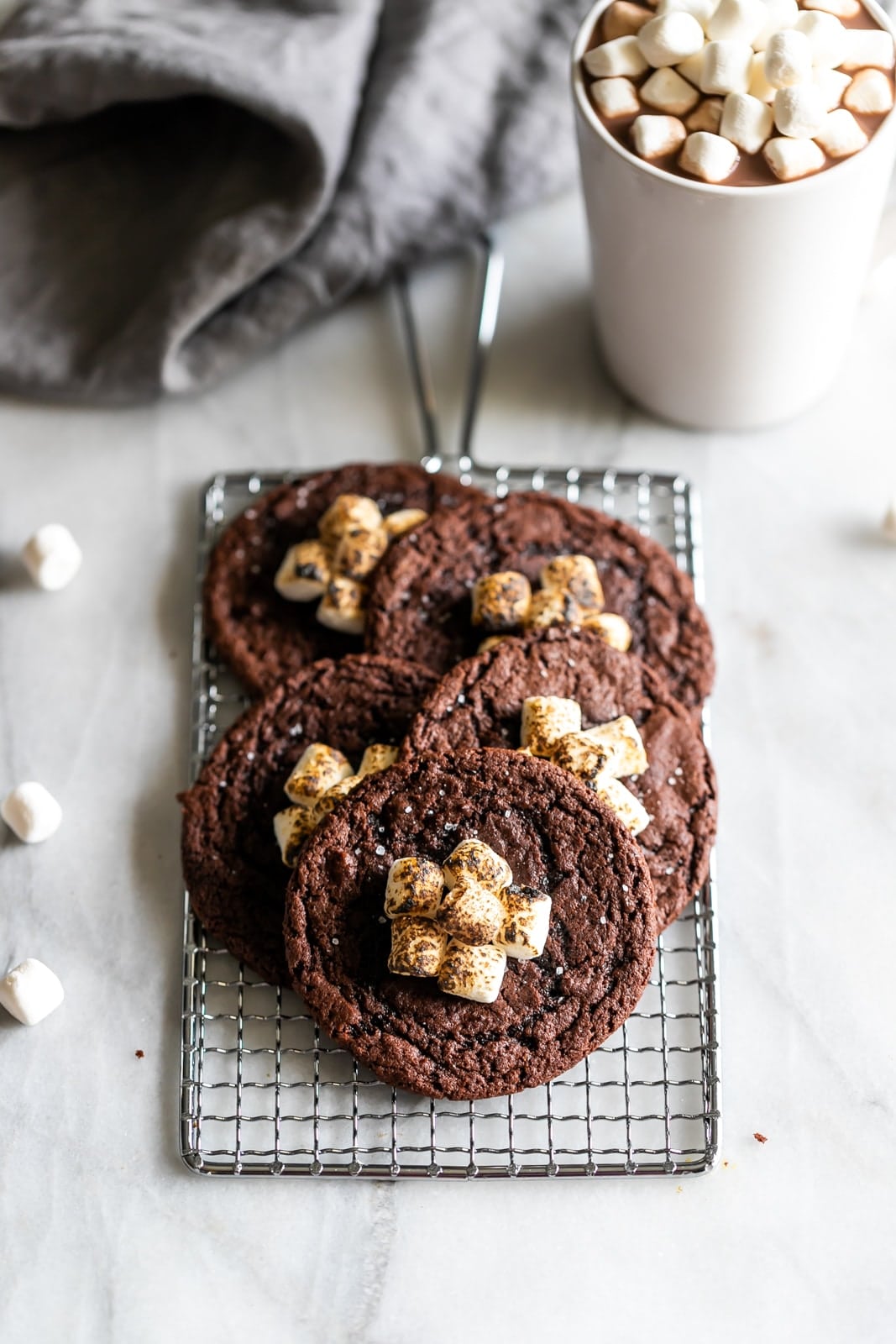 Boozy hot chocolate cookies! Rich, soft, and chewy chocolate cookies spiked with your favorite liqueur and topped with gooey torched mini marshmallows.