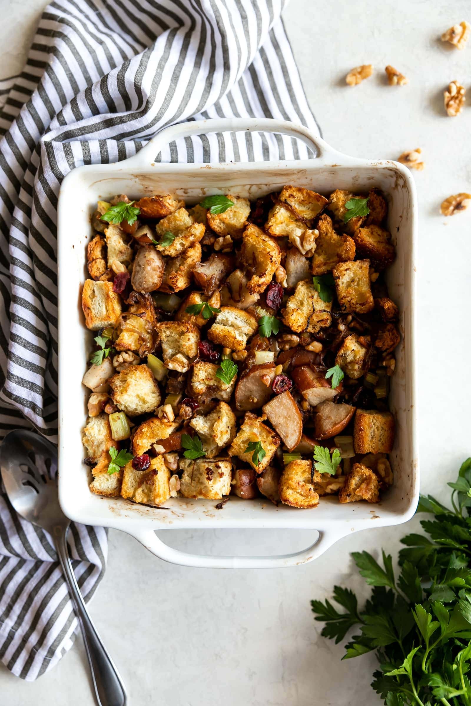 Caramelized Onion Pear & Walnut Stuffing. A flavorful and easy-to-make Thanksgiving stuffing made with caramelized onions, pears, celery, walnuts, and dried cranberries.