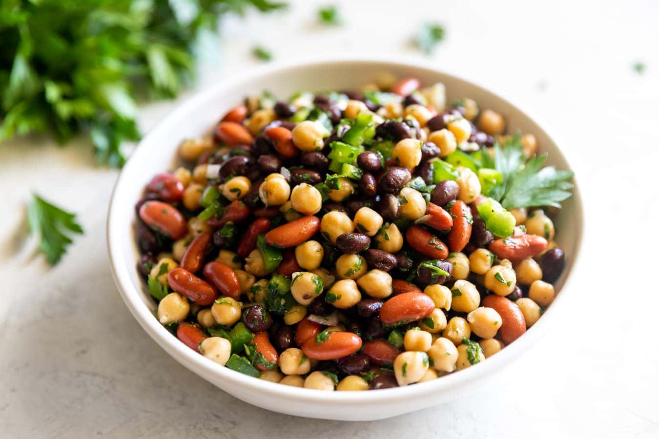 easy chimichurri three bean salad in a small bowl