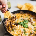 A smoky queso fundido dip made with chipotle mushrooms, roasted poblano peppers, and Mexican chorizo. Easy to make and perfect for game day! #quesofundido