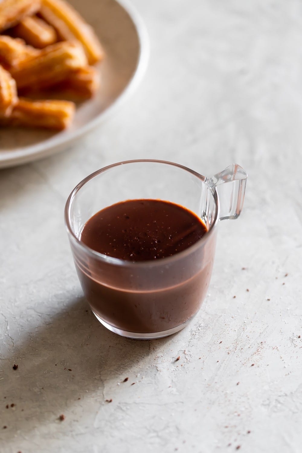 cup of Spanish hot chocolate with churros slightly out of frame