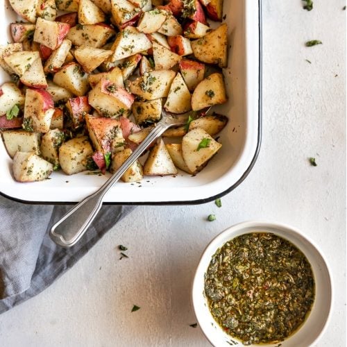 The easiest side dish ever. Roasted potatoes tossed in a delicious, super easy to make cilantro garlic chimichurri sauce!