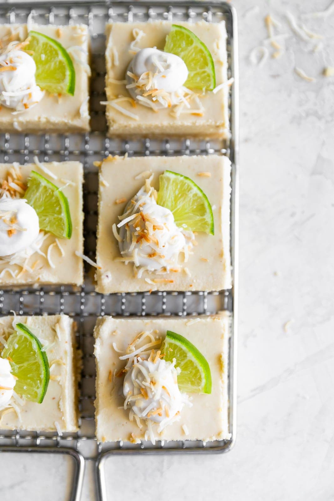Dairy-free, grain-free, gluten-free, and refined sugar free coconut key lime pie bars made with wholesome ingredients. The perfect dessert for just about any occasion!