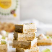 dairy-free coconut key lime pie bars stacked on top of each other
