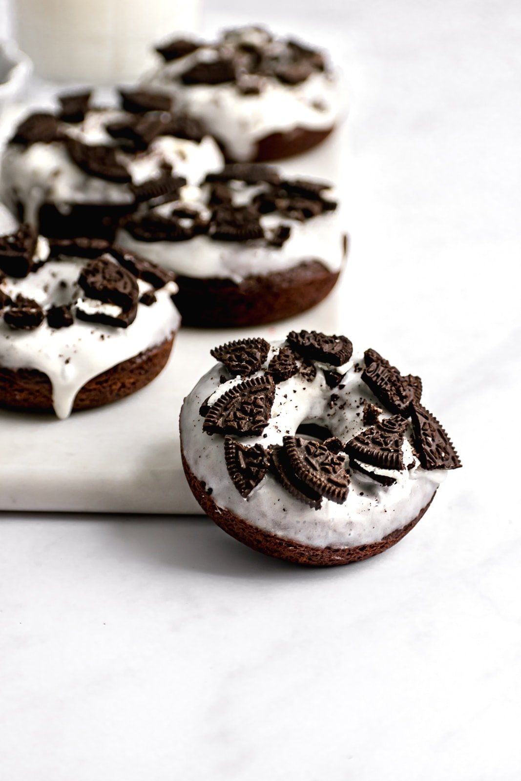 oreo donuts with milk on a marble slab