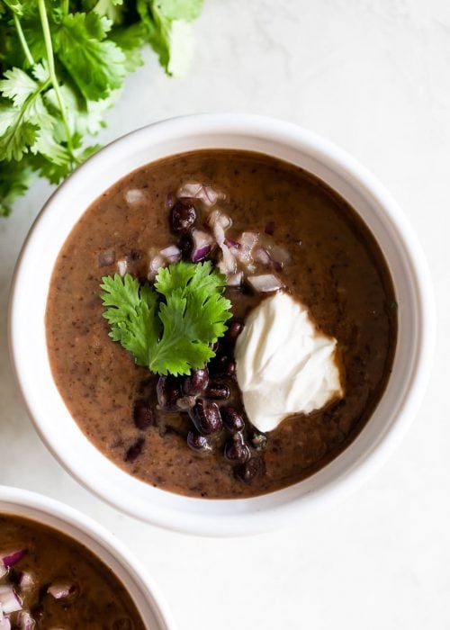 Rich, creamy, and easy-to-make Cuban black bean soup made with canned beans. Quick weeknight meal that is ready in just 25 minutes!