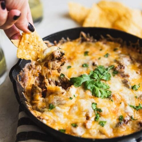 A smoky queso fundido dip made with chipotle mushrooms, roasted poblano peppers, and Mexican chorizo. Easy to make and perfect for game day! #quesofundido