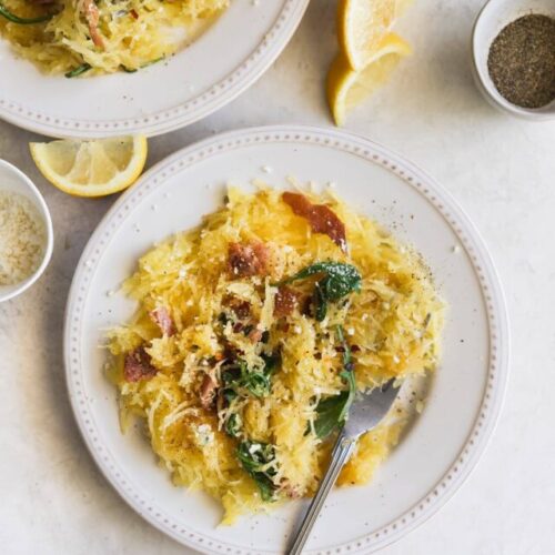 Lemony Cacio e Pepe Spaghetti Squash. A flavorful, low carb meal made with roasted spaghetti squash, lemon, arugula, pancetta, red pepper flakes, grated Parm and fresh pepper. Healthy weeknight dinner!