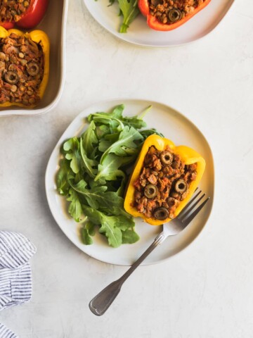Cuban-Style Vegan Picadillo Stuffed Peppers. This vegan picadillo is a plant-based meal made Cuban-style with lentils, spices, onions, garlic, tomatoes, olives then stuffed in bell peppers. Perfect weeknight dinner!