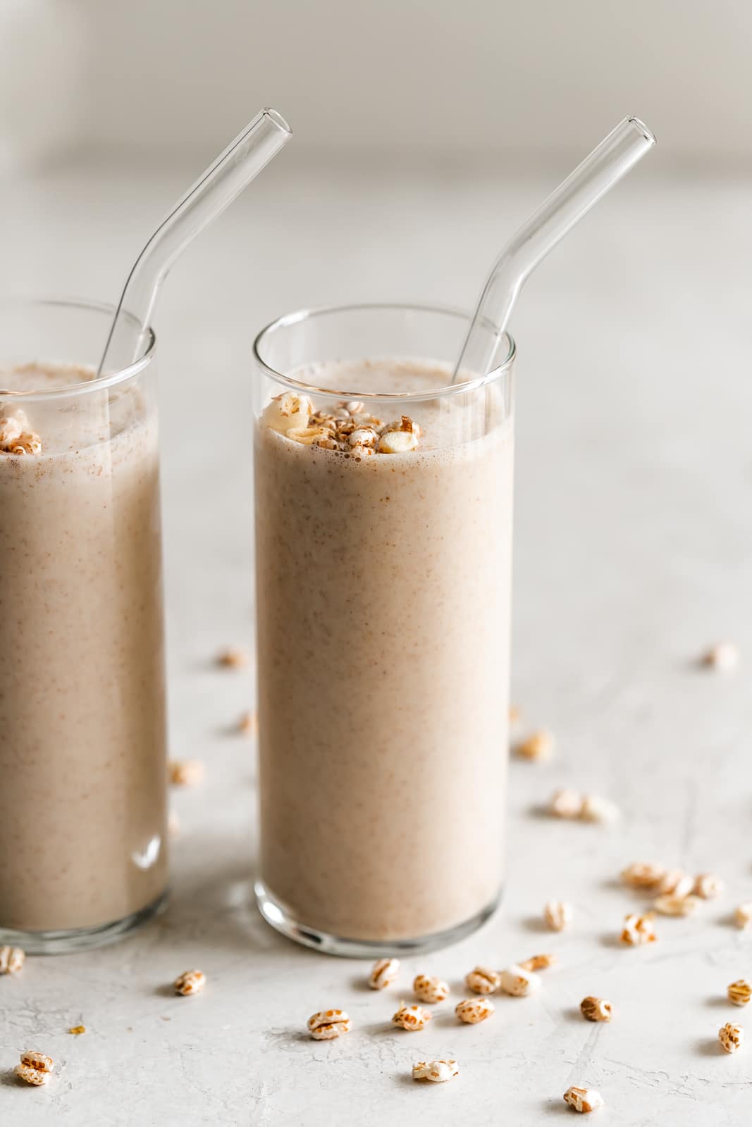 tall glasses with cuban wheat milkshake and puffed wheat cereal on top