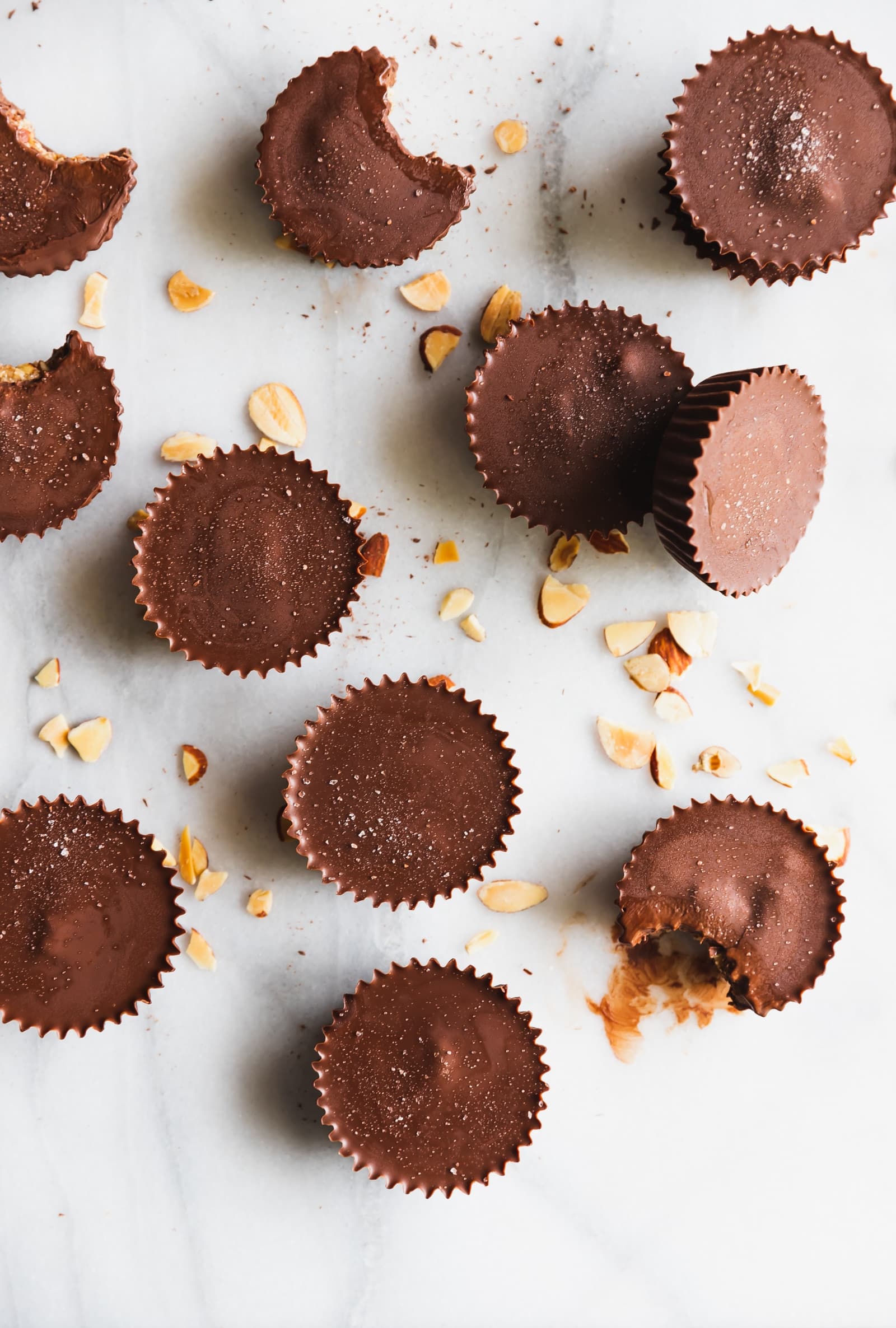 These almond butter cups are made with just 5 ingredients -  dark chocolate, coconut oil, almond butter, chopped almonds, and sea salt. Perfect snack!