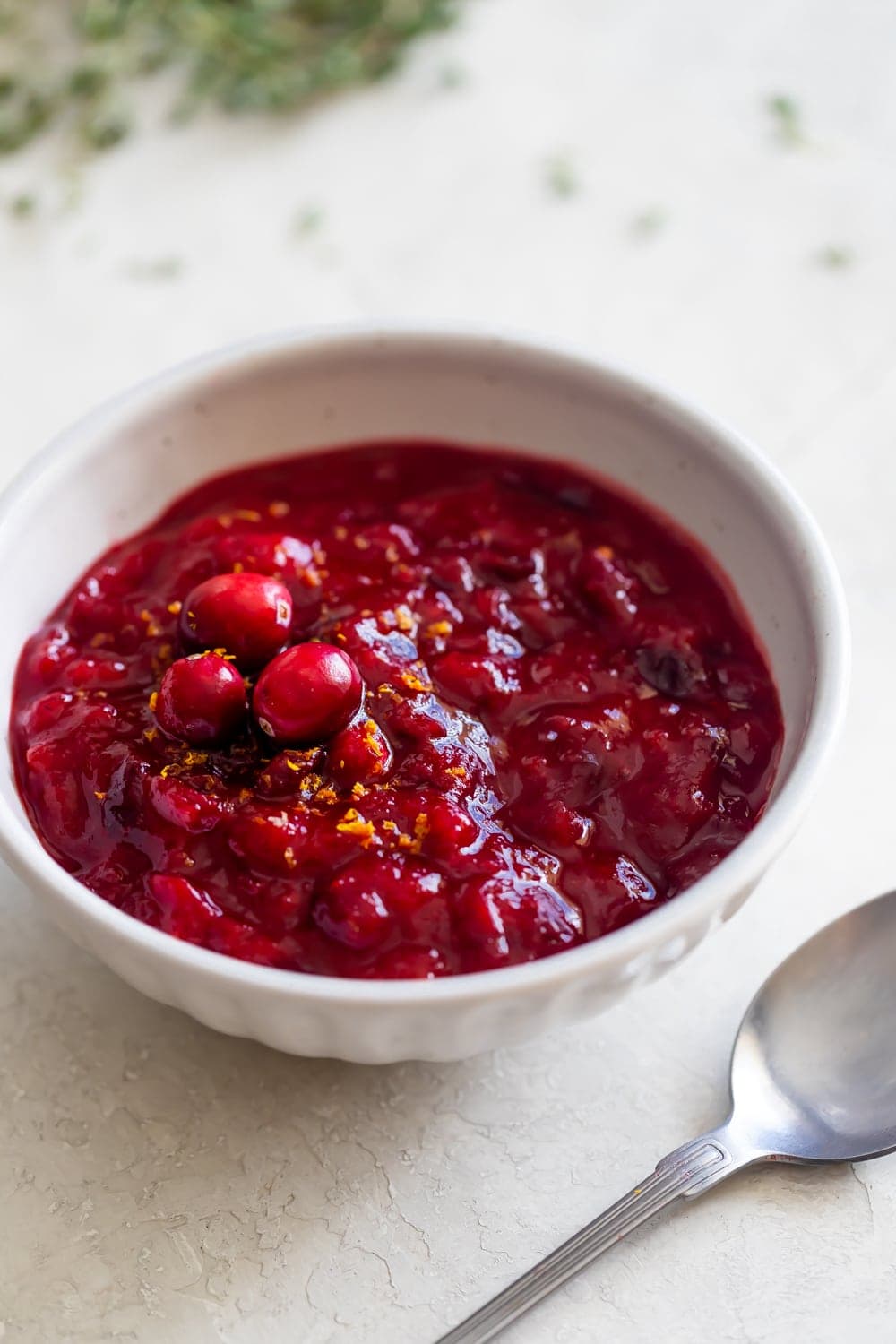 guava cranberry sauce in a white bowl on a white table