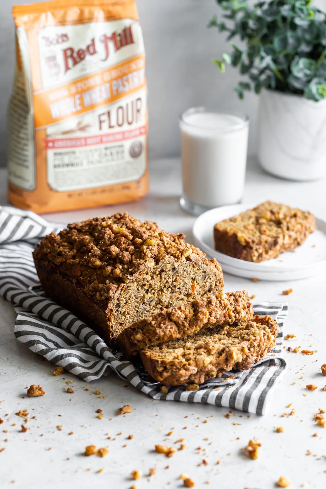 Dairy-free, refined sugar-free, moist carrot cake banana bread made with wholesome ingredients and a crunchy walnut crumble topping!
