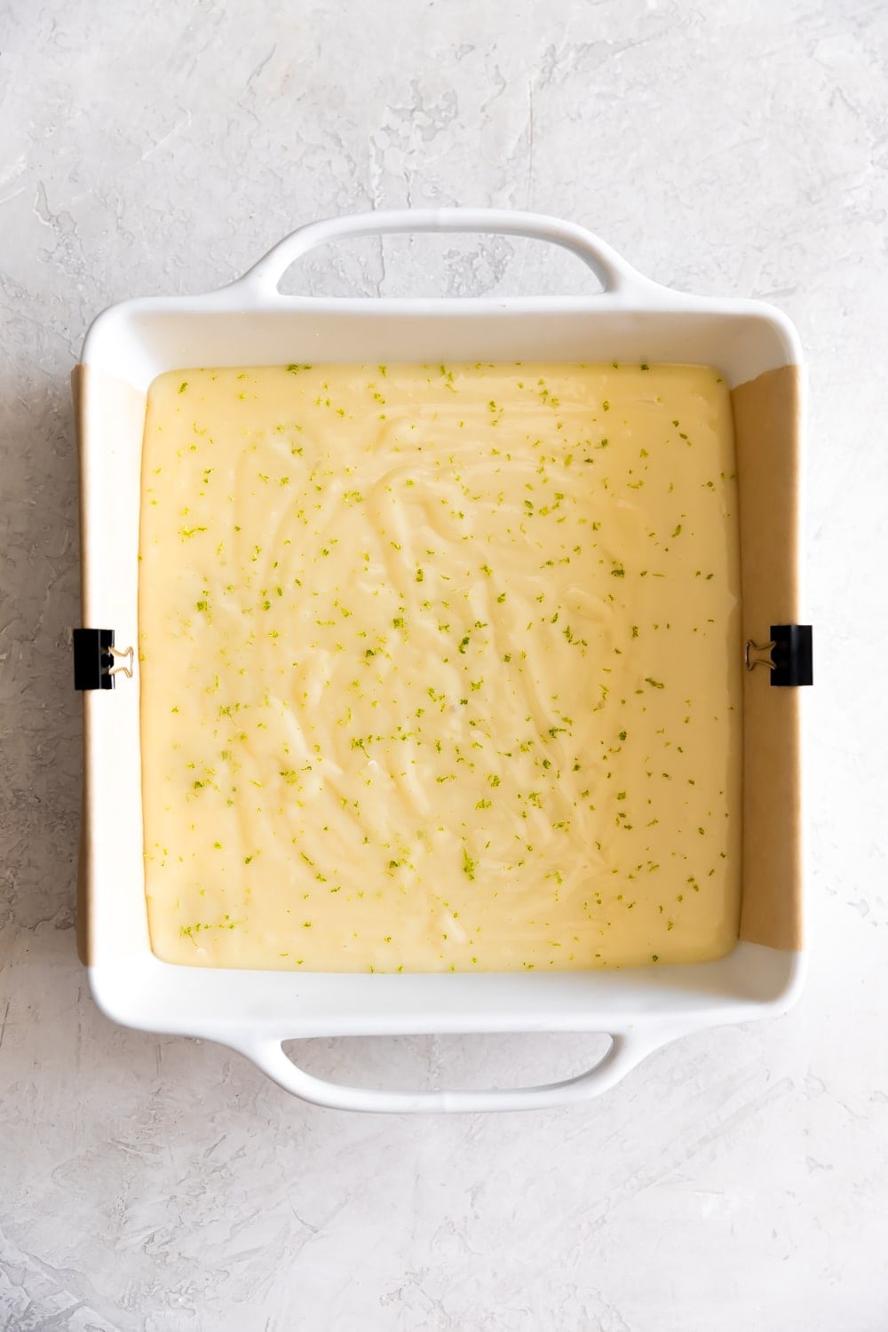 key lime fudge in a baking dish with lime zest on top