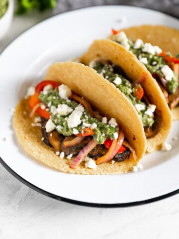 vegetarian tacos with mushrooms, peppers, onions, feta cheese