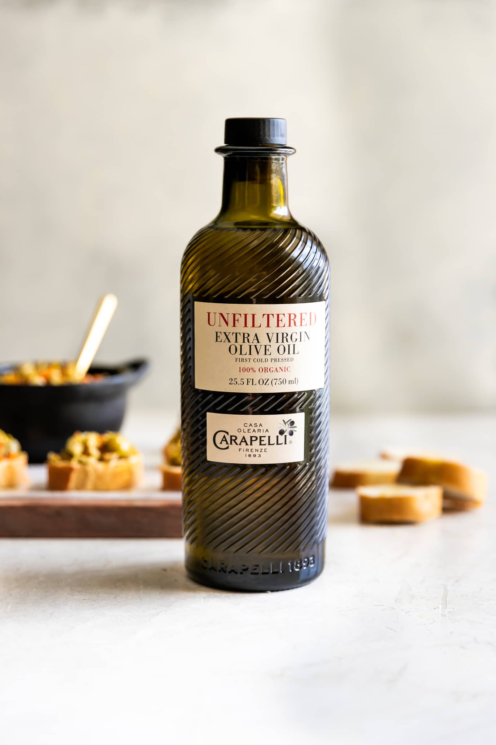 A simple yet irresistible appetizer made with tart, briny olives, capers, fresh garlic, pepper, and olive oil then served on toasted baguette slices brushed with olive oil.