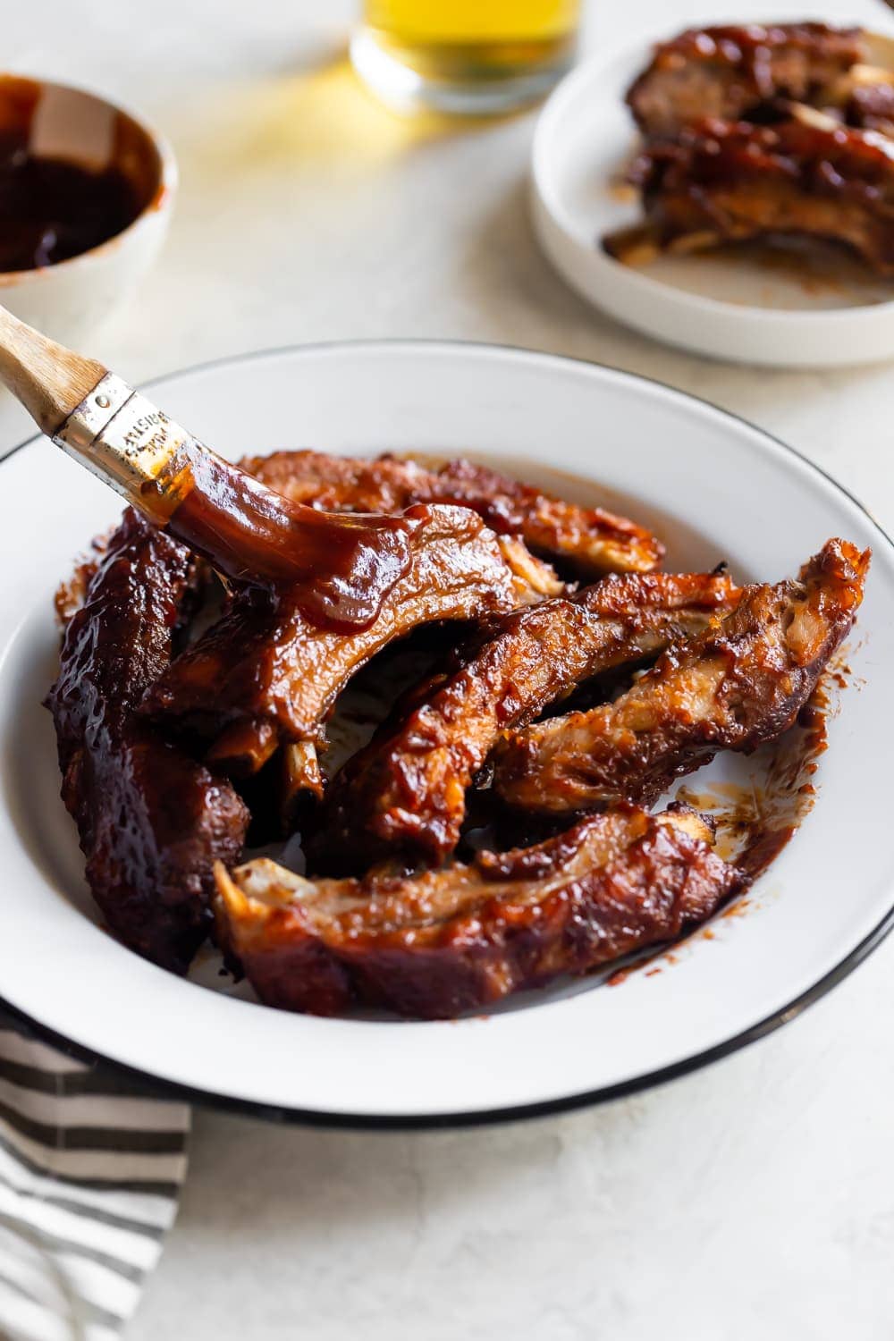 baby back ribs with barbecue sauce brushed on top