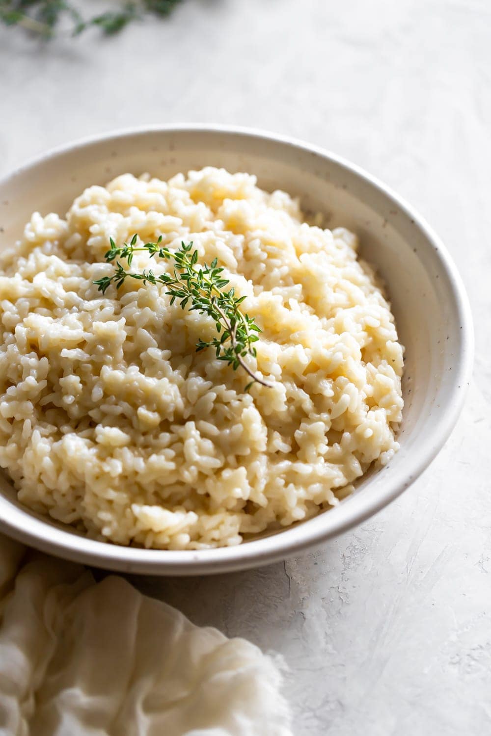 ceramic bowl with parmesan risotto and thyme